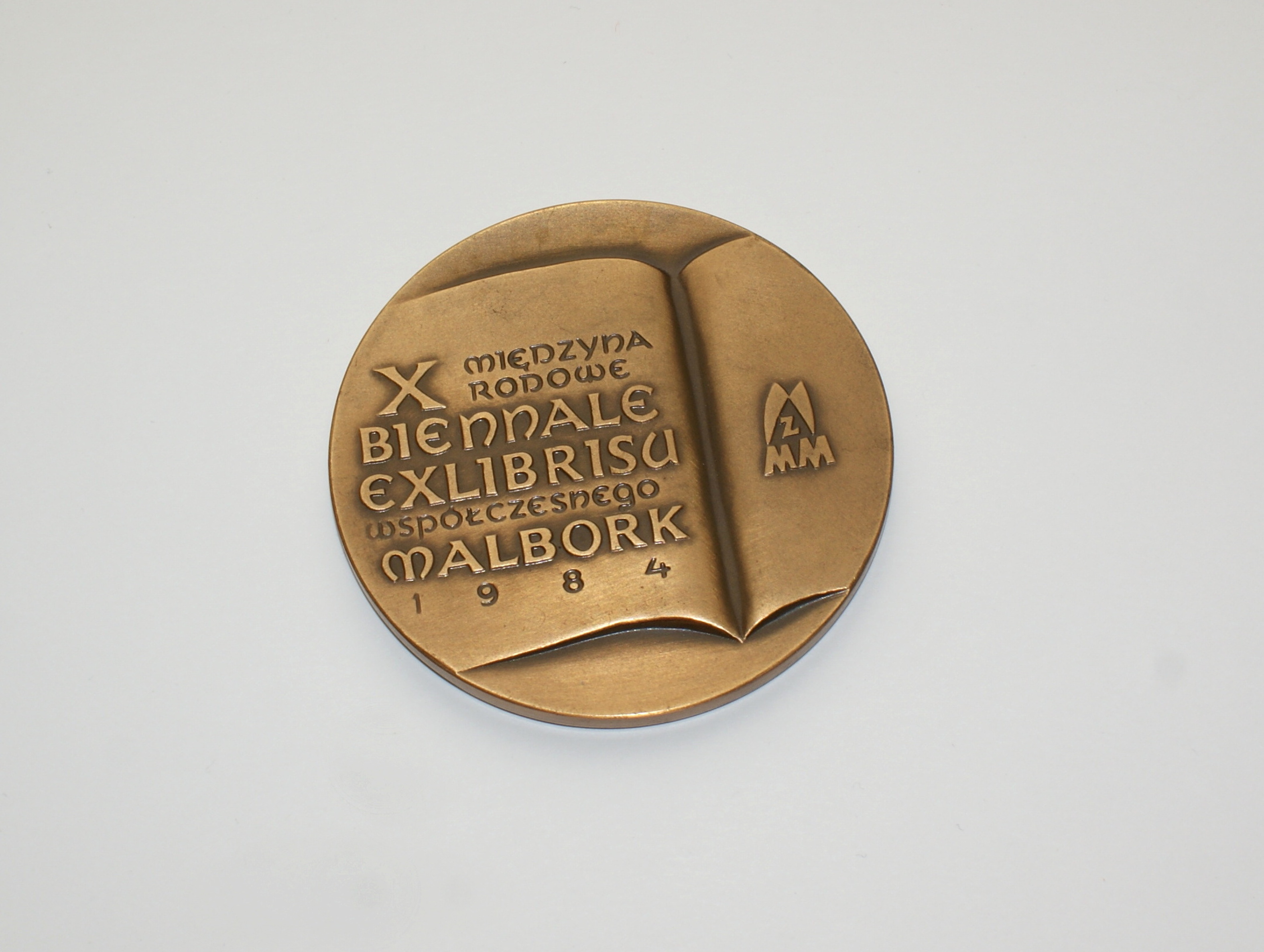 Náhledový obrázek Bronzová plaketa - X. Międzynarodowe Biennale Exlibrisu Współczesnego - 1